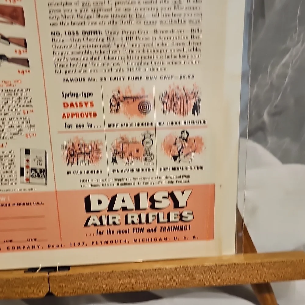 Daisy Air Rifleman Outfit Poster with Red and White Design